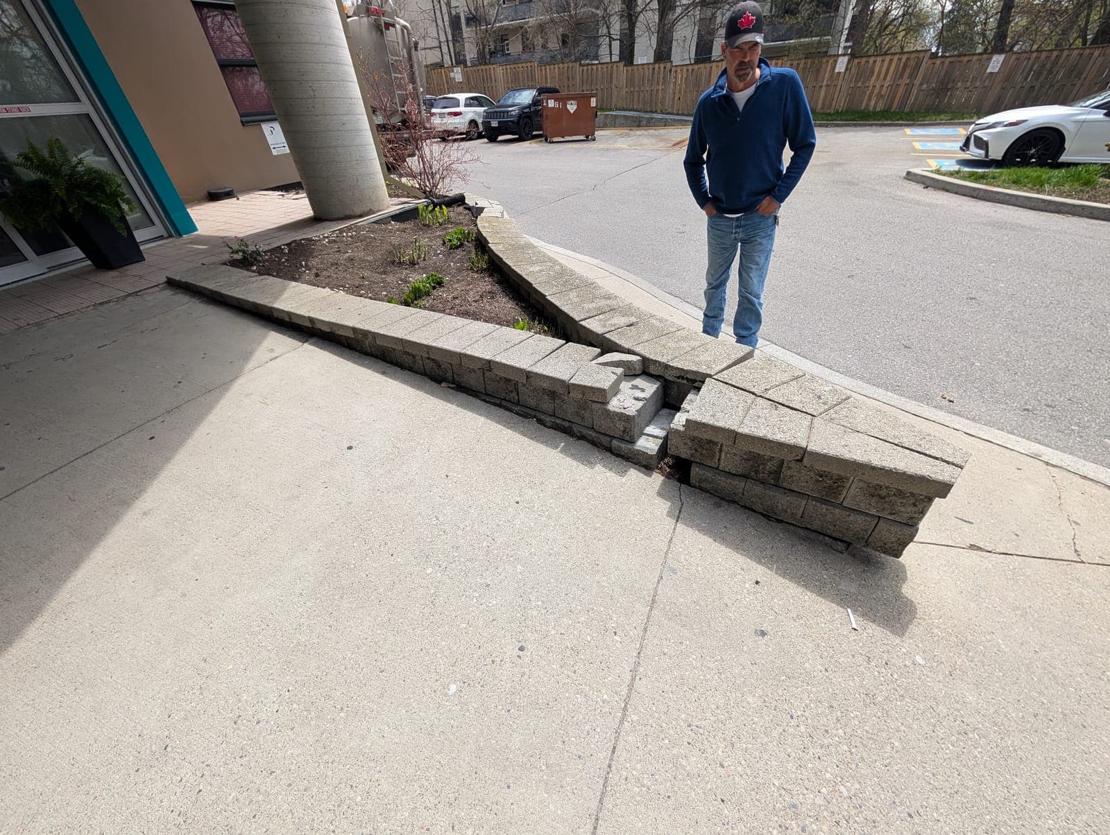 Segmental block retaining wall with separated blocks under repair assessment