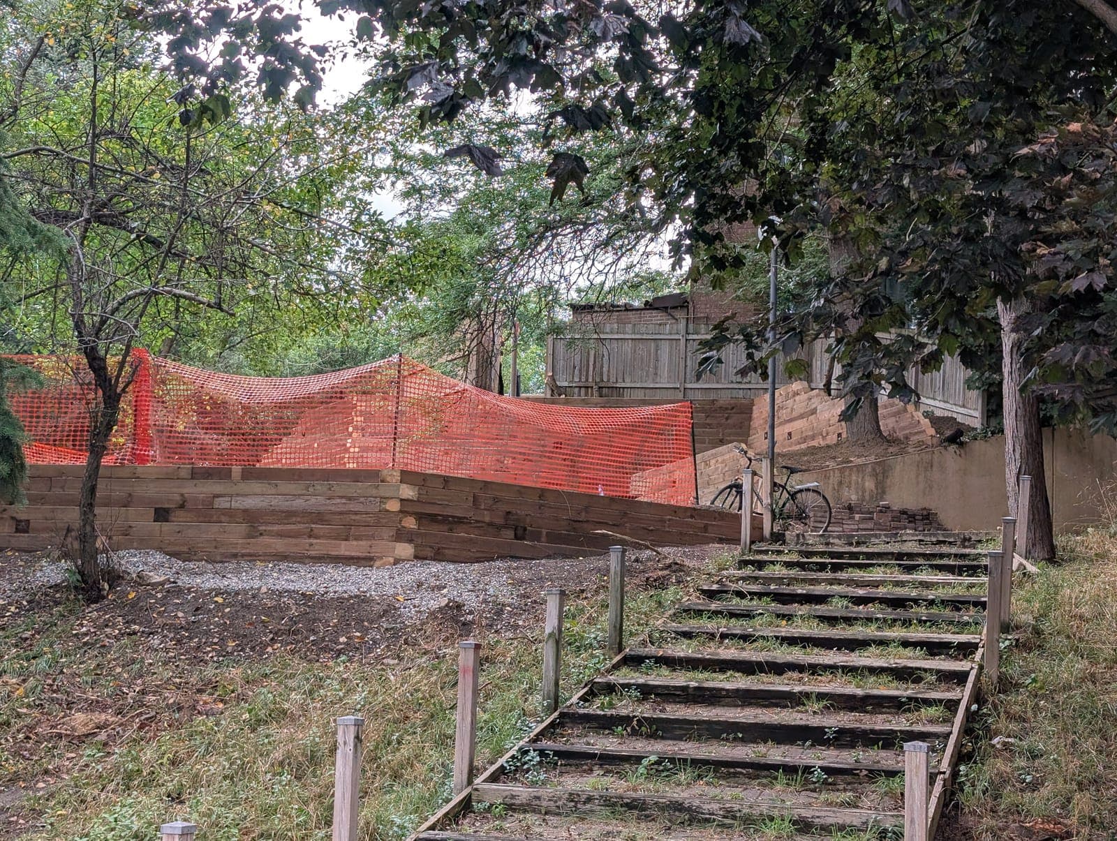 Low timber retaining wall with wooden garden steps during backyard construction