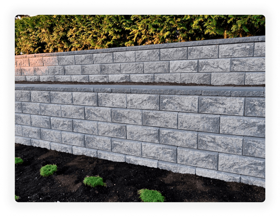 Long-lasting block retaining wall with garden landscaping in London, Ontario